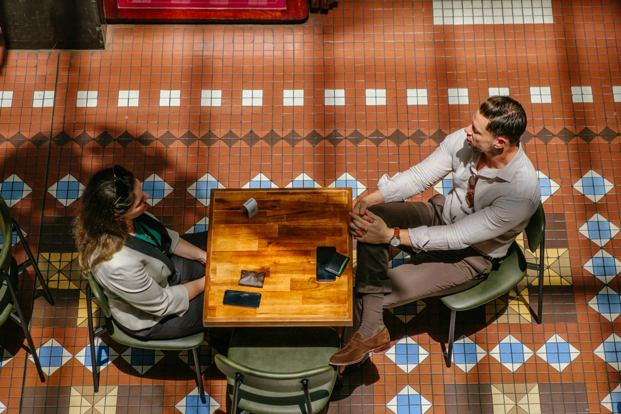 Business buyers and sellers meeting around a table in a Sydney office