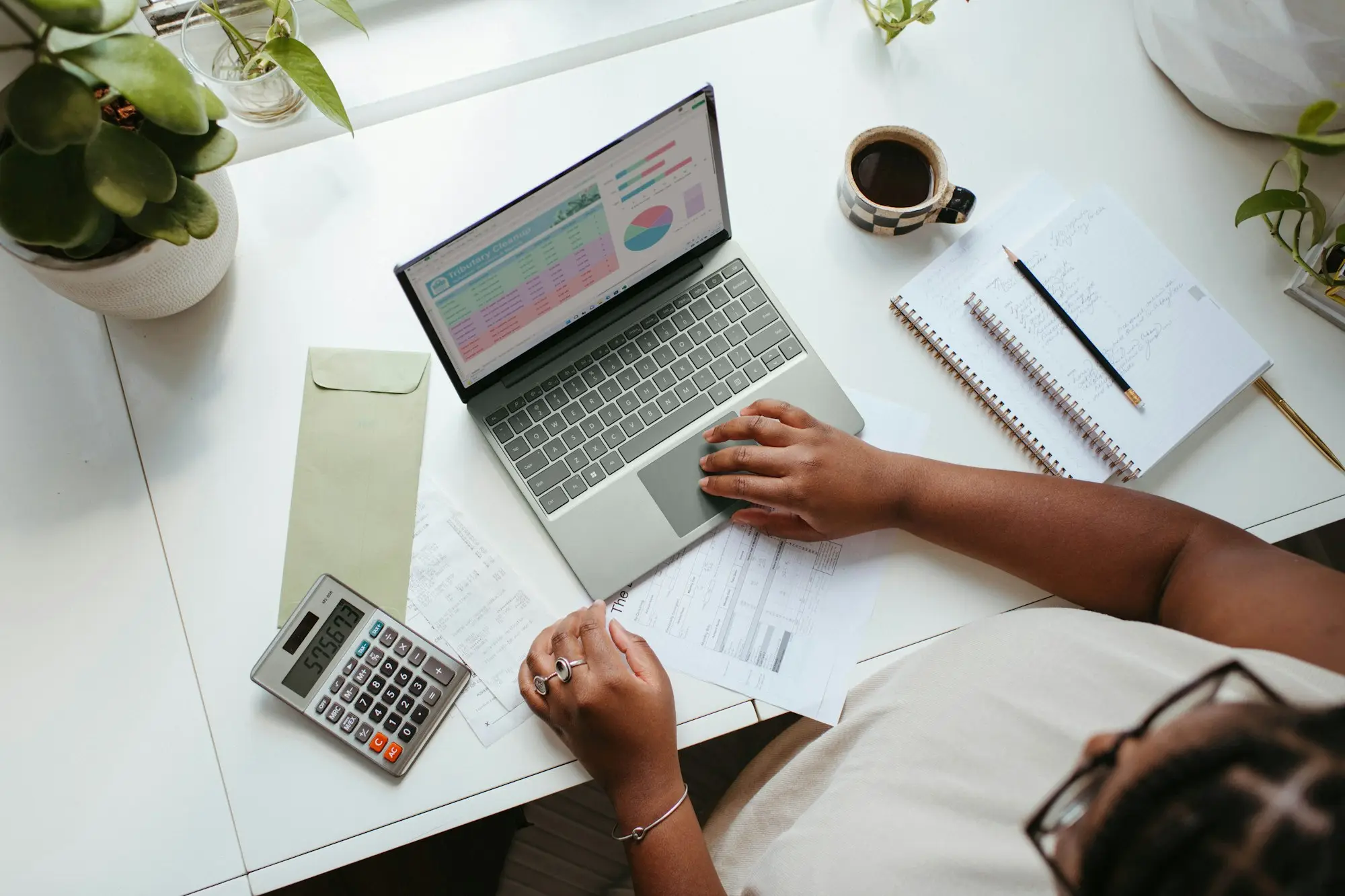 Accountant and client going through year-end accounts on a laptop