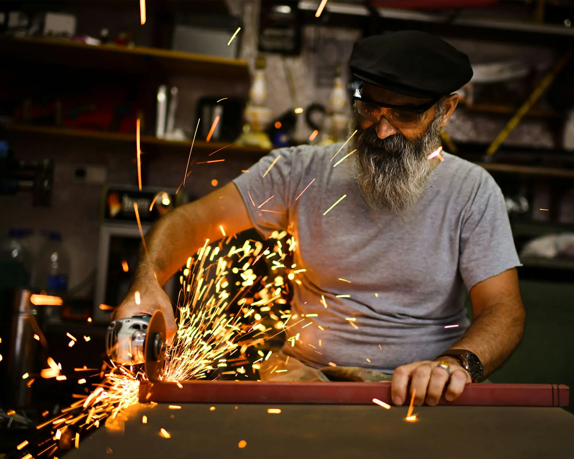 Experienced owner cutting steel in the family workshop he built