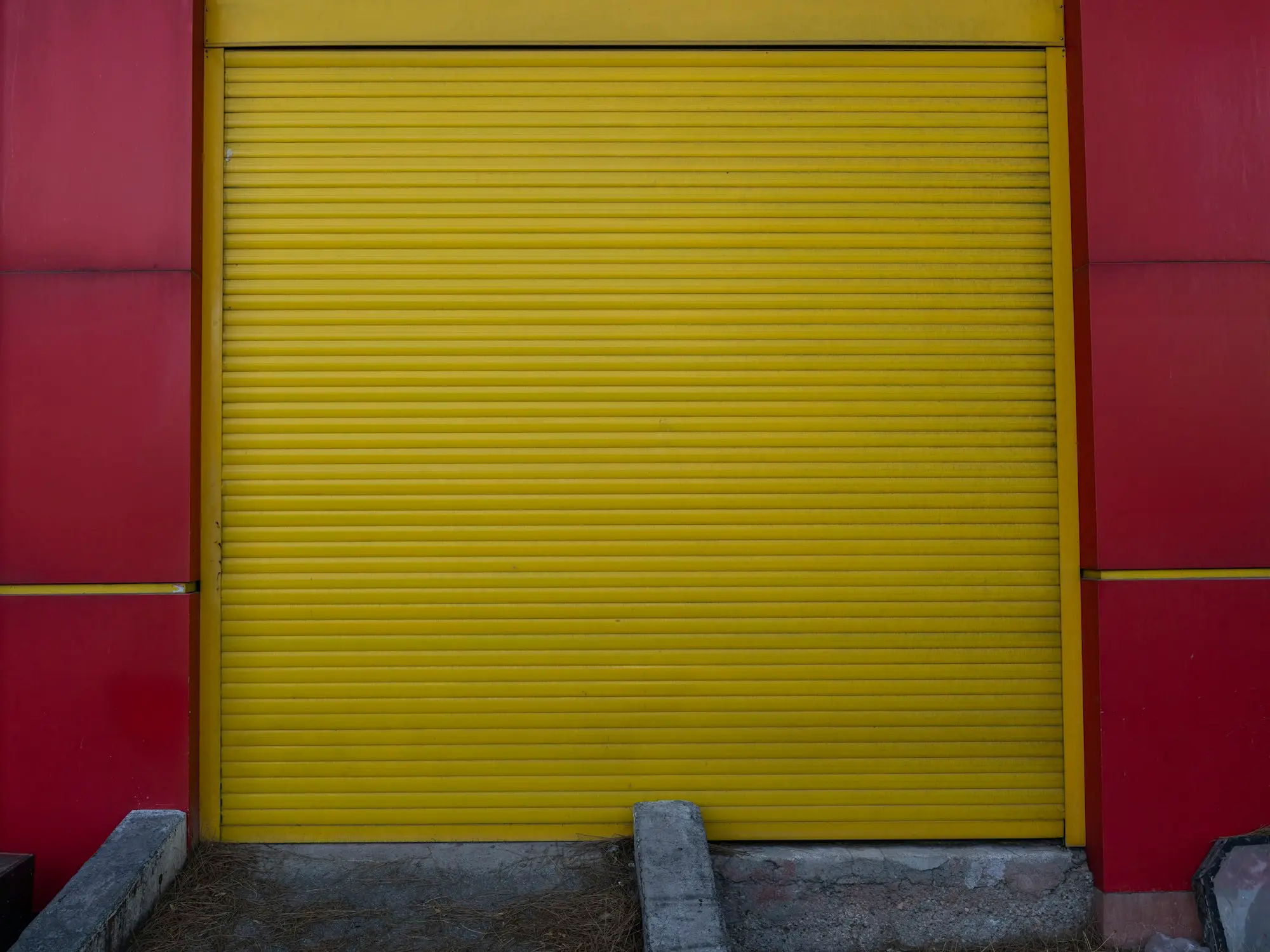 Yellow roller door on an industrial warehouse